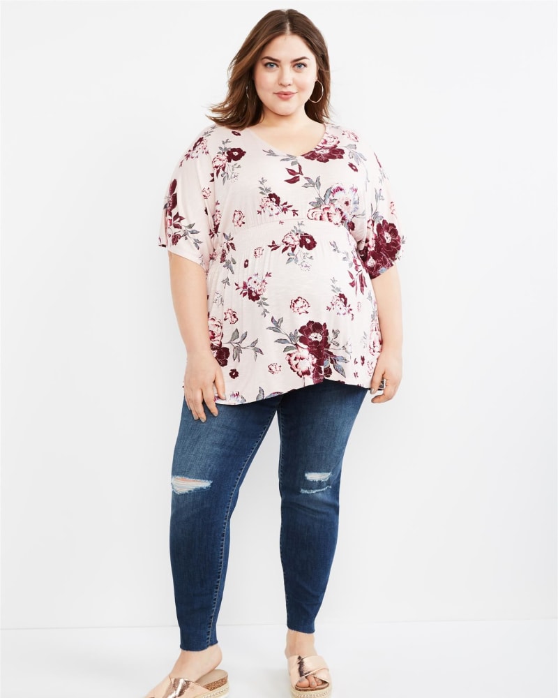 Front of a model wearing a size 2X Motherhood Maternity Women's Secret Fit Belly Skinny Leg Maternity Ankle Jeans in Pink by Motherhood Maternity. | dia_product_style_image_id:305144